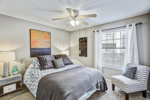 Cozy bedroom with modern furnishings at Stratford Station Apartments