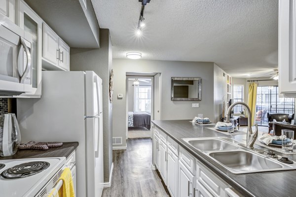 Stratford Station Apartments: Modern kitchen with sleek countertops and stainless appliances, perfect for luxury living