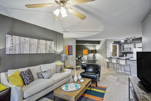 Spacious living room with modern decor and ample natural light at Stratford Station Apartments