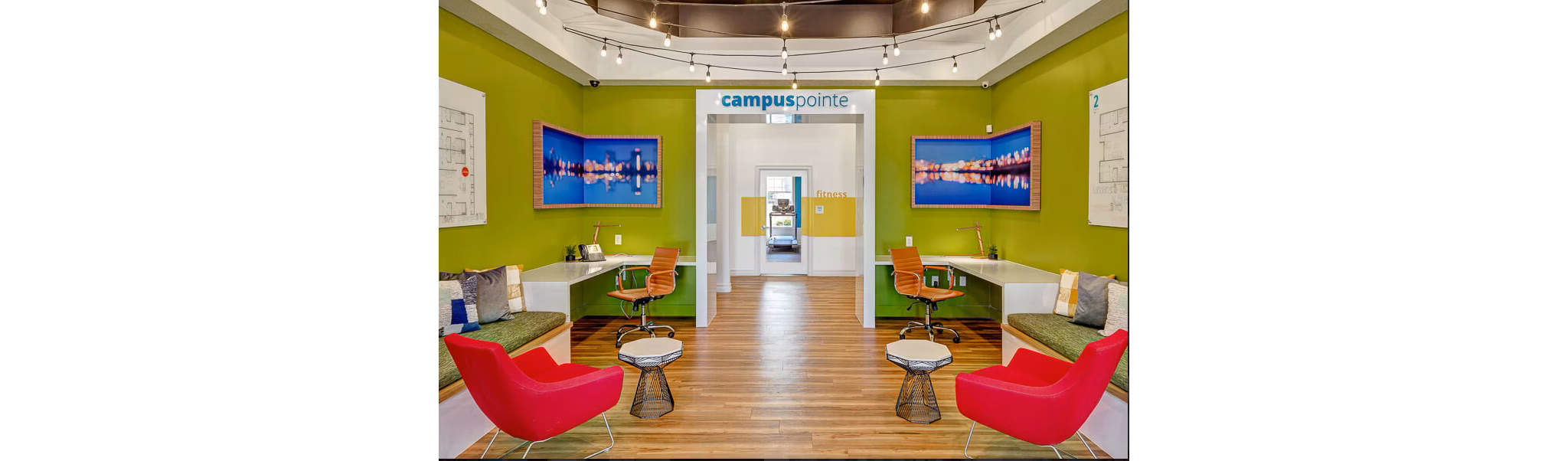 Clubhouse with modern decor at Campus Pointe Apartments, featuring cozy seating and social spaces