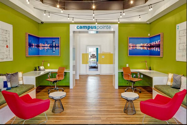 Clubhouse with modern decor at Campus Pointe Apartments, featuring cozy seating and social spaces