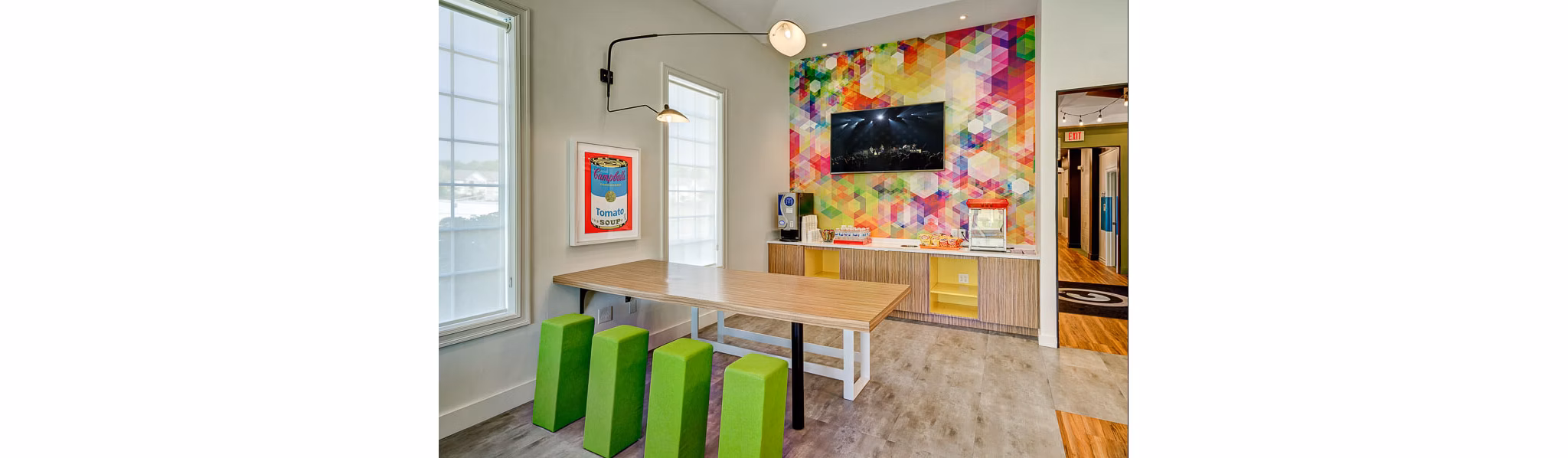 Campus Pointe Apartments: Modern clubhouse featuring comfortable seating and communal areas