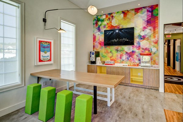 Campus Pointe Apartments: Modern clubhouse featuring comfortable seating and communal areas
