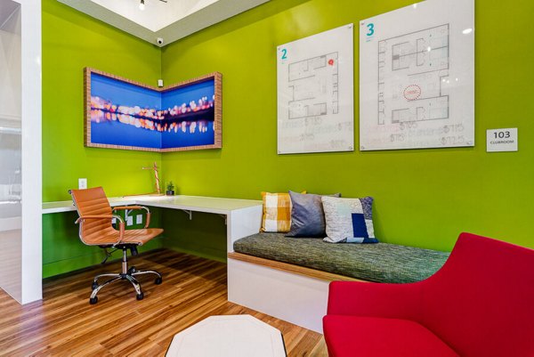 Modern clubhouse with cozy seating and a fireplace at Campus Pointe Apartments Ideal for gatherings and relaxation