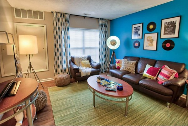 Spacious living room with modern decor at Campus Pointe Apartments