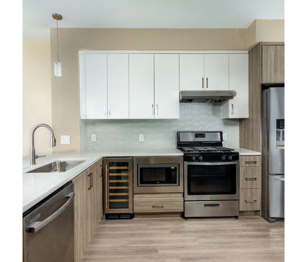 Modern kitchen with stainless steel appliances at The Core on Foothill Apartments, luxury living by Greystar