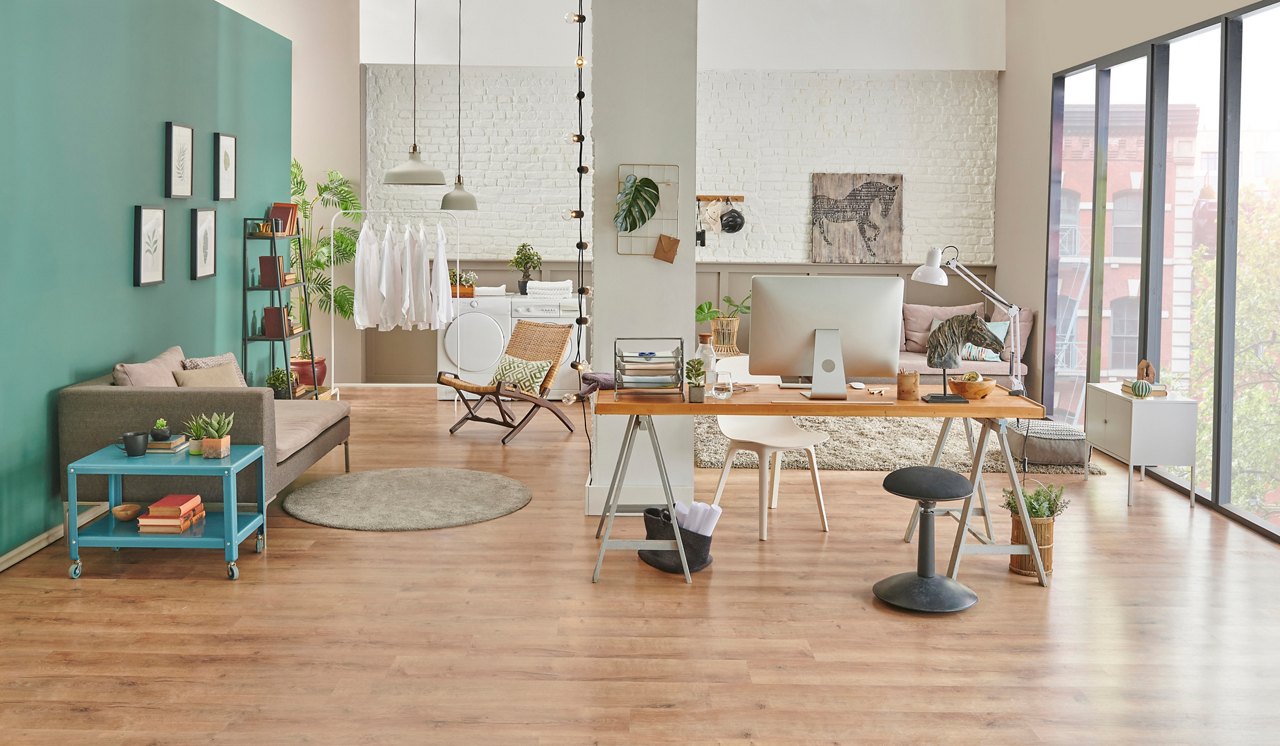 Working table and decorative living room style, modern home concept with laptop notebook poster and armchair decor.