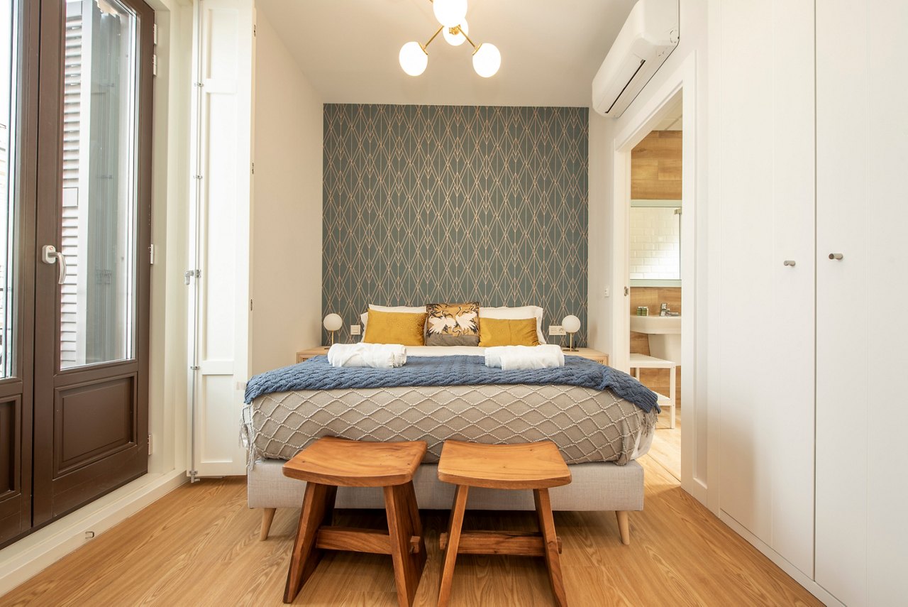 Sleeping area with king size bed in a newly decorated and furnished vacation rental studio