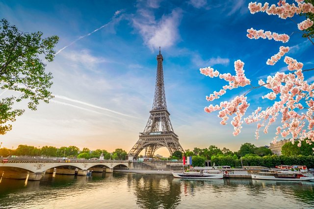 Paris Eiffel Tower and river Seine with sunrise in Paris, France. Eiffel Tower is one of the most iconic landmarks of Paris, web banner format ar early spring morning