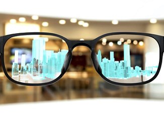 Clear eyeglasses showcasing a holographic cityscape, symbolizing augmented reality vision.