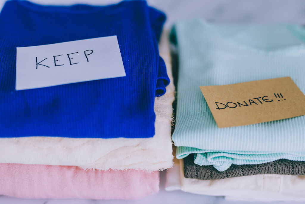 Donate and keep piles of clothes