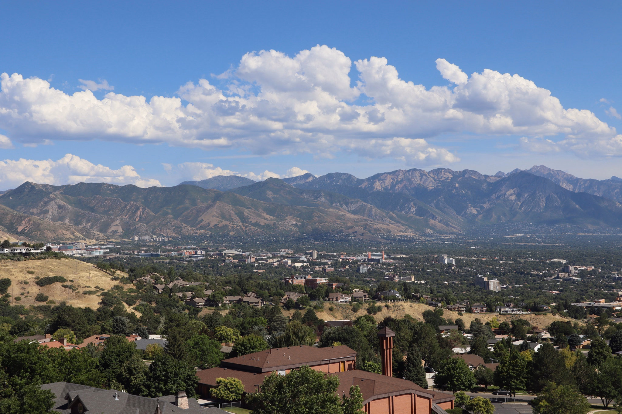 A beautiful mountain range surrounding Salt Lake City on a sunny day, Utah