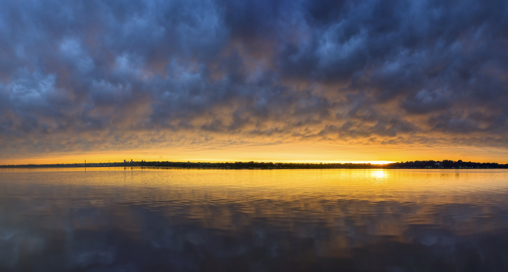 Sunset and turbulent Clouds at White Rock Lake. Dallas Texas