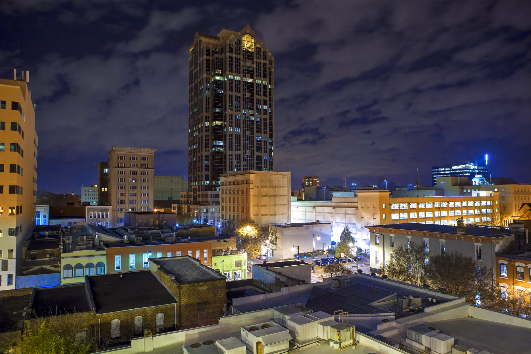 Urban rooftop view of Raleigh, North Carolina at night