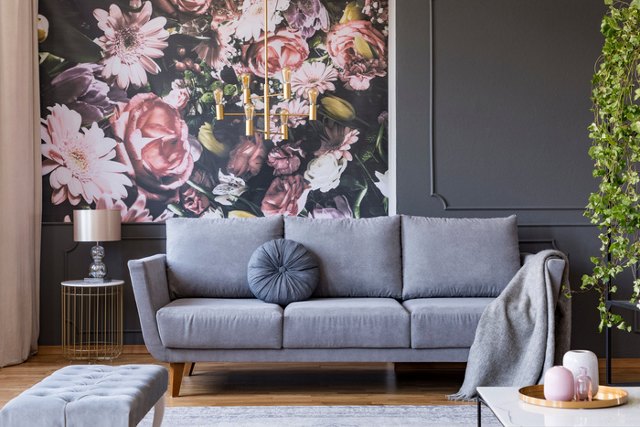 Grey couch with a floral wallpaper background | Blog | Greystar