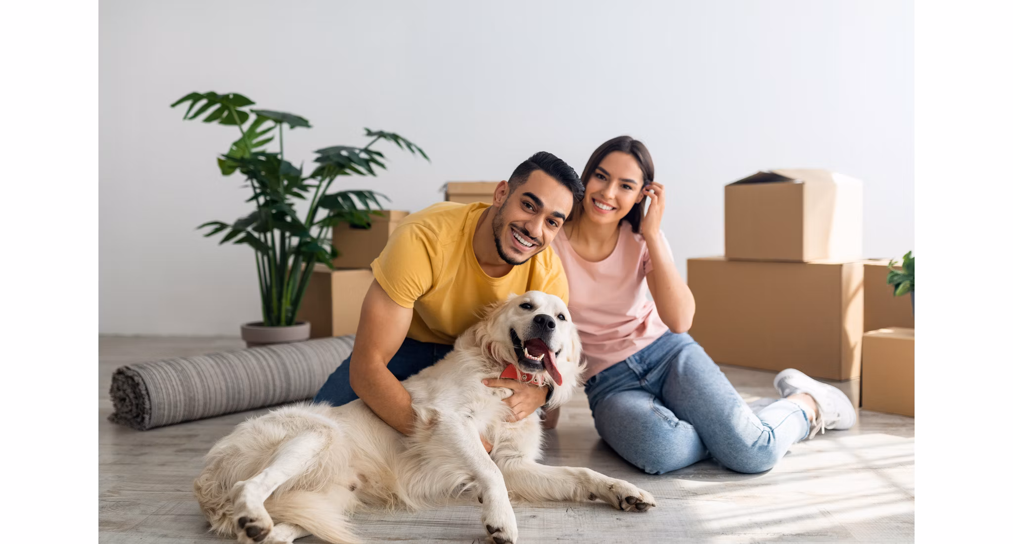 Diverse couple with a white lab | Blog | Greystar