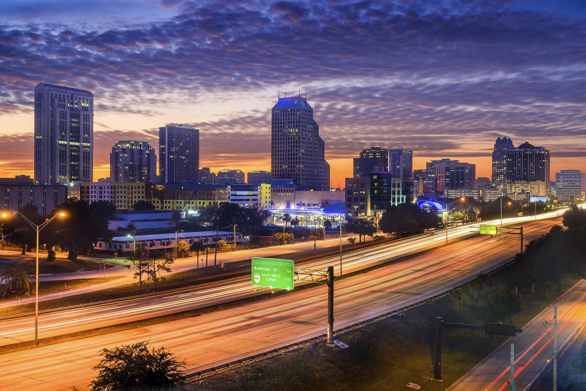 Orlando, Florida, USA skyline over the highway.