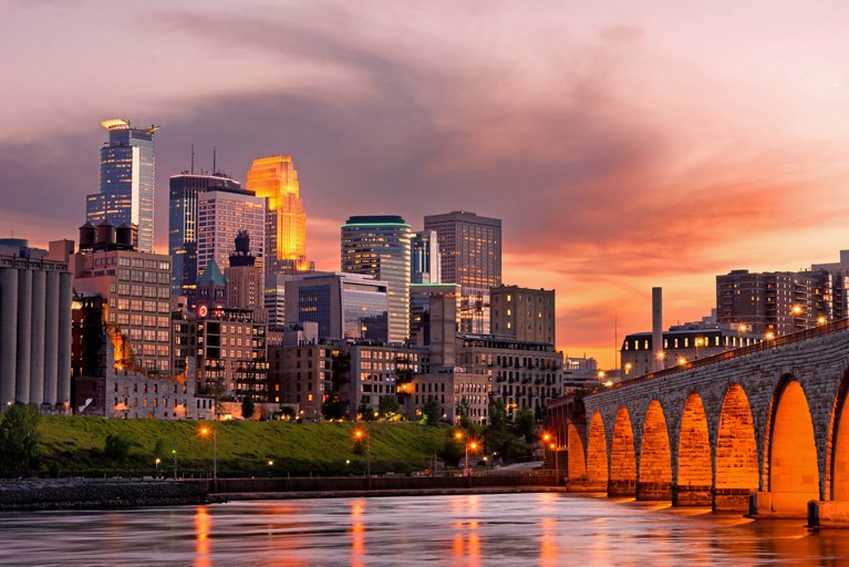 Minneapolis Minnesota Downtown and the Stone Arch Bridge at Sunset