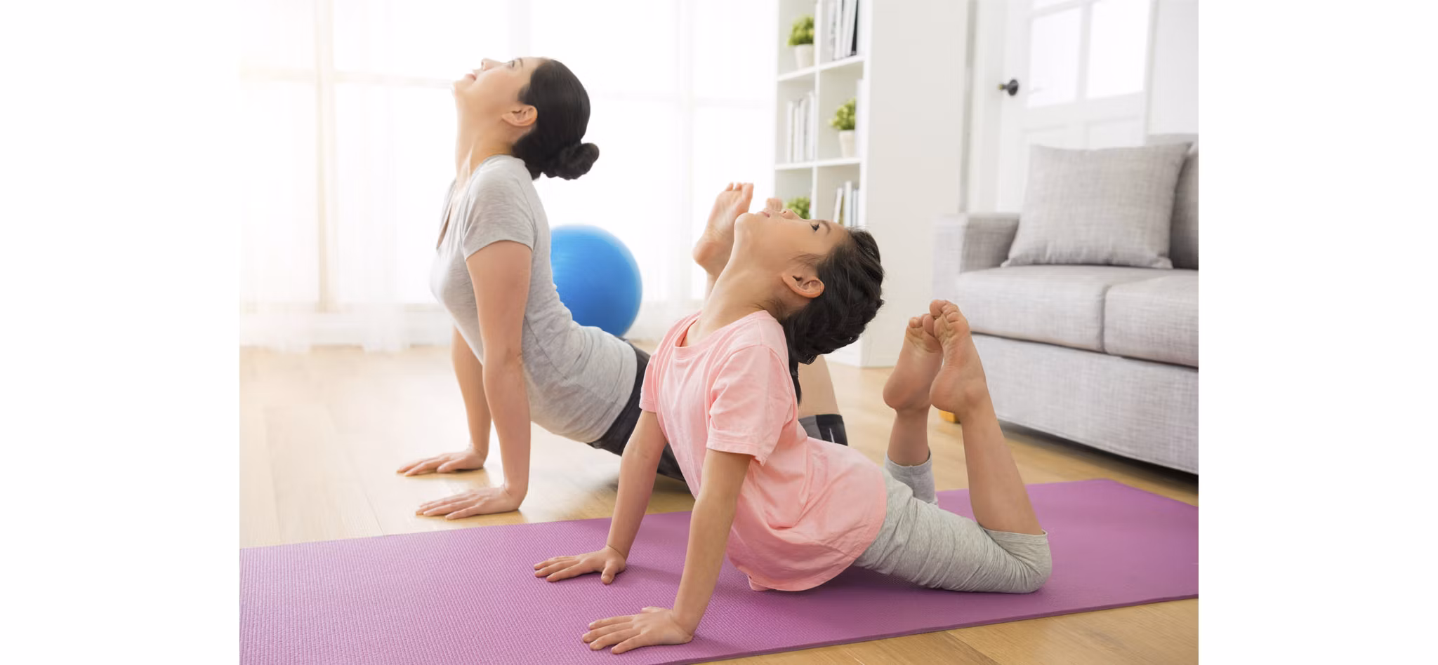 Mother and Daughter do Yoga