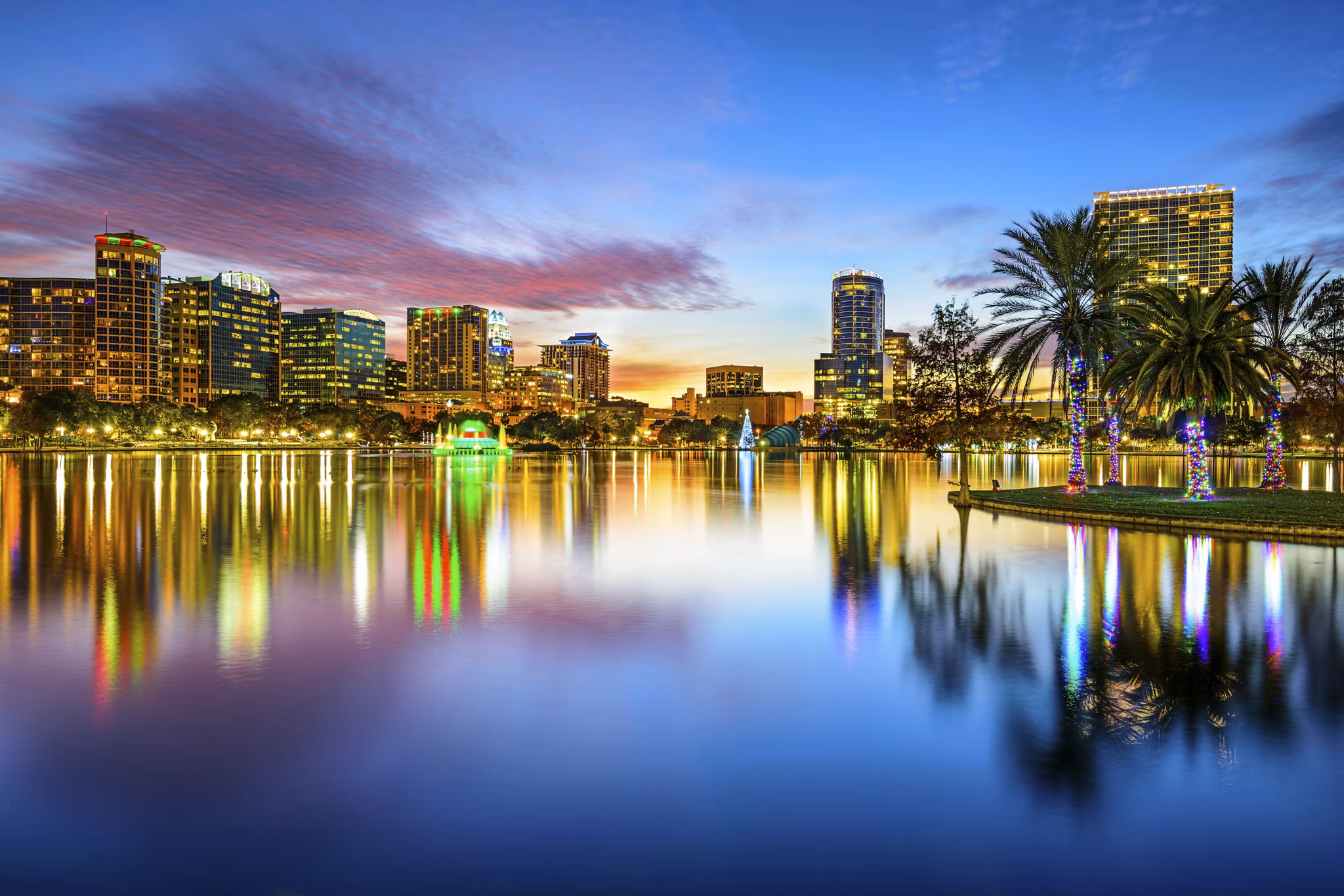 Orlando, Florida, USA downtown city skyline on Eola Lake.