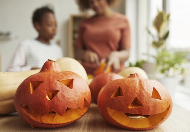 Family Carving a Pumpkin | Blog | Greystar