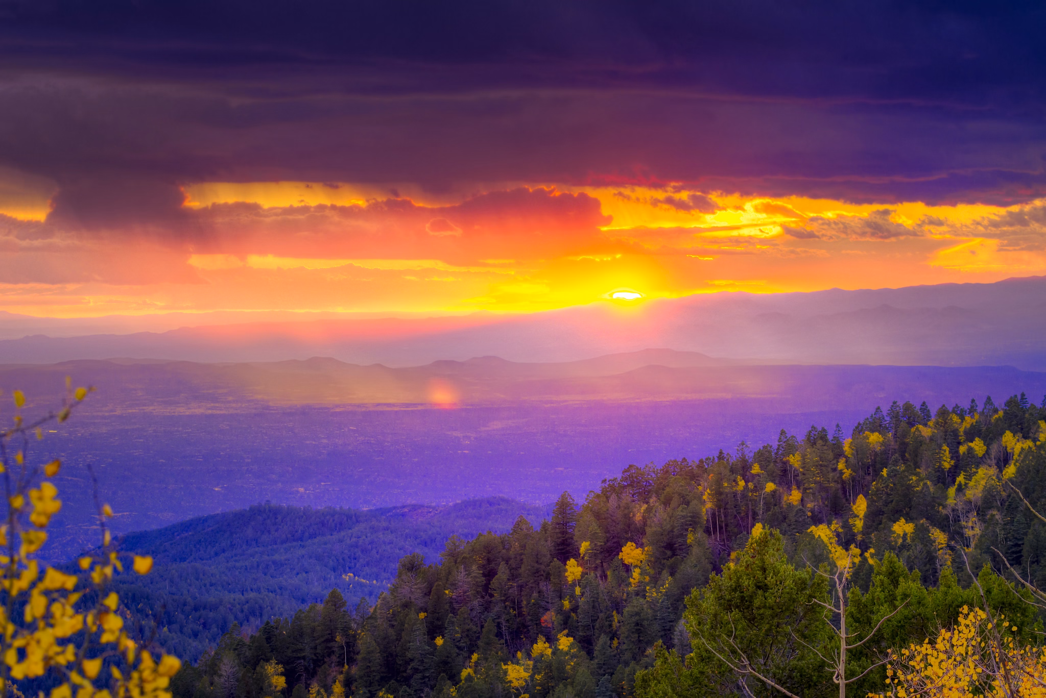 New Mexico fall mountain sunset  featuring golden aspens and rays of sunlight