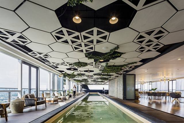 Indoor lounge pool with communal seating space | Blog | Greystar