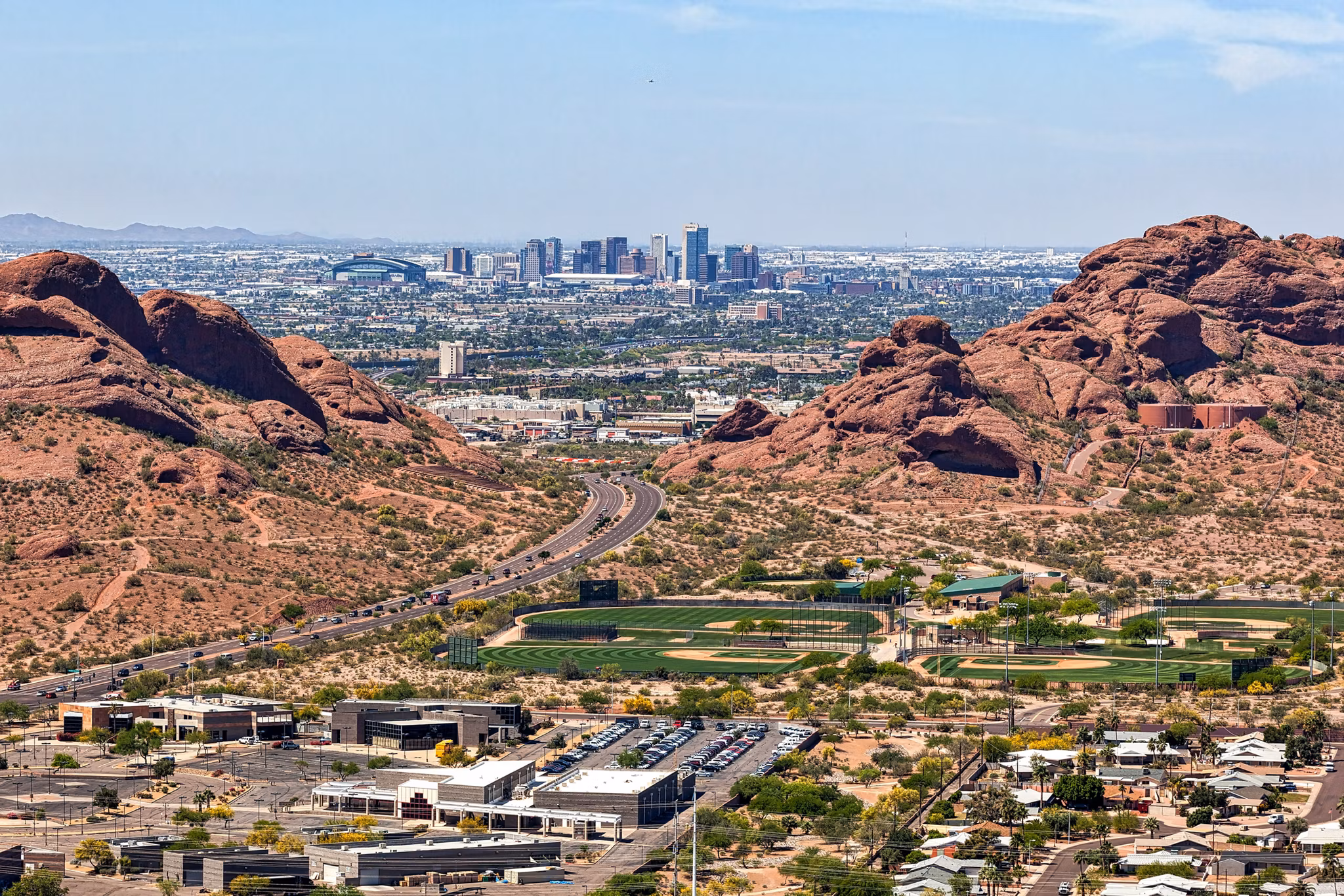 Downtown Phoenix, Arizona aerial view from Scottsdale framed between the Papago Buttes