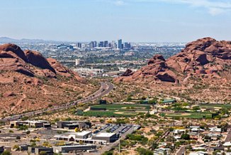 Downtown Phoenix, Arizona aerial view from Scottsdale framed between the Papago Buttes