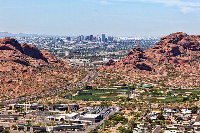 Downtown Phoenix, Arizona aerial view from Scottsdale framed between the Papago Buttes