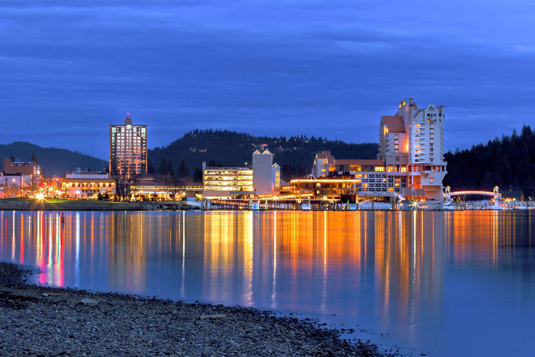 The view of downtown Coeur d'Alene early in the evening from the beach area.