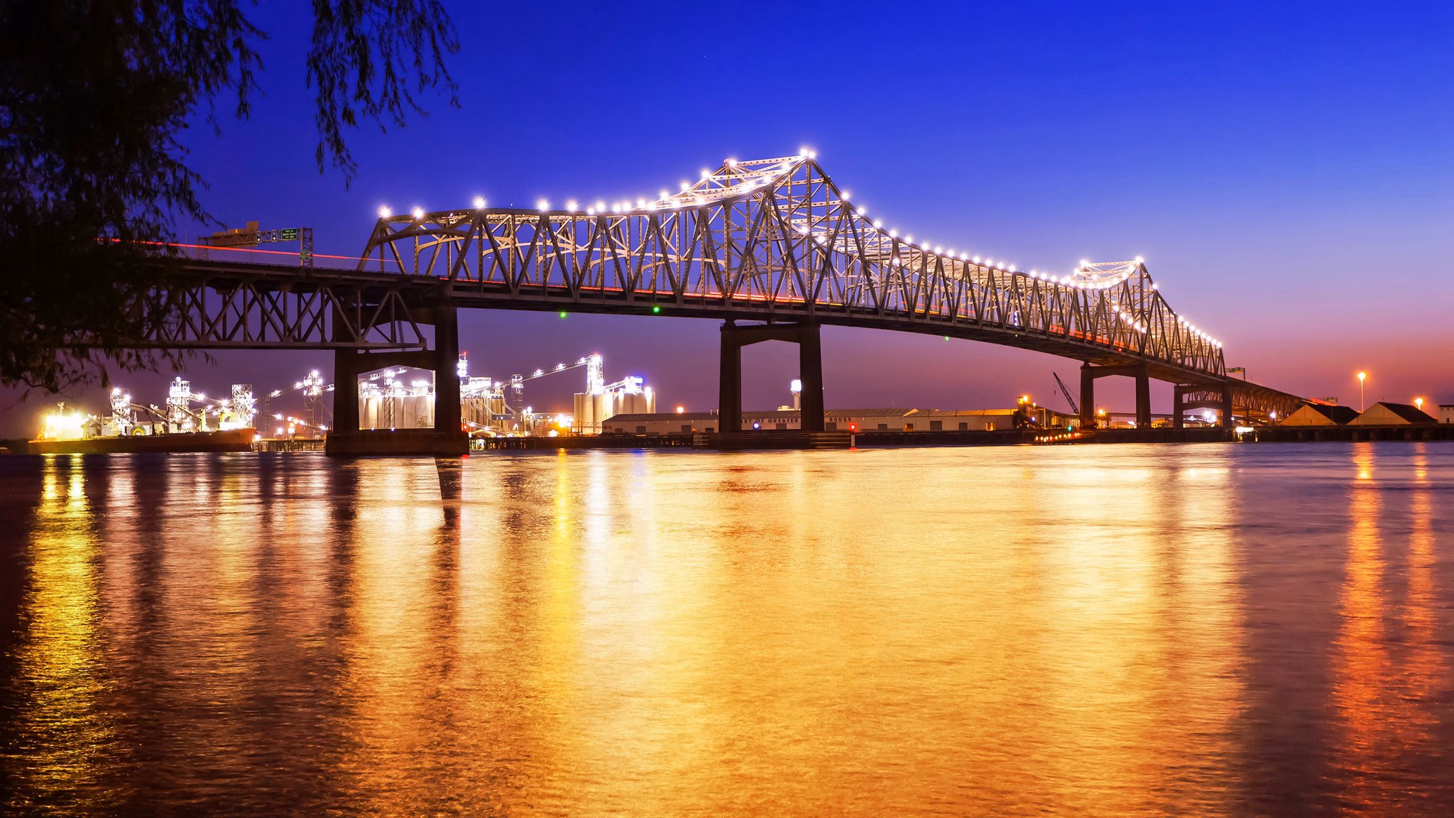 Horace Wilkinson Bridge crosses over the Mississippi River at night in Baton Rouge, Louisiana
