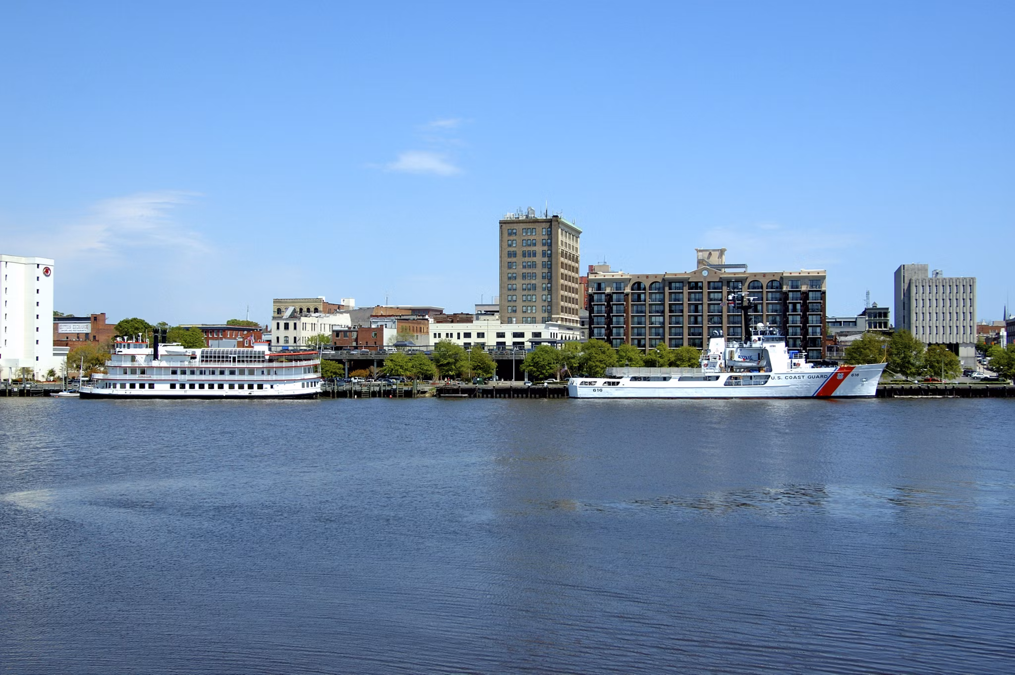 Cape Fear River waterfront view with downtown Wilmington apartments and buildings - North Carolina riverfront living