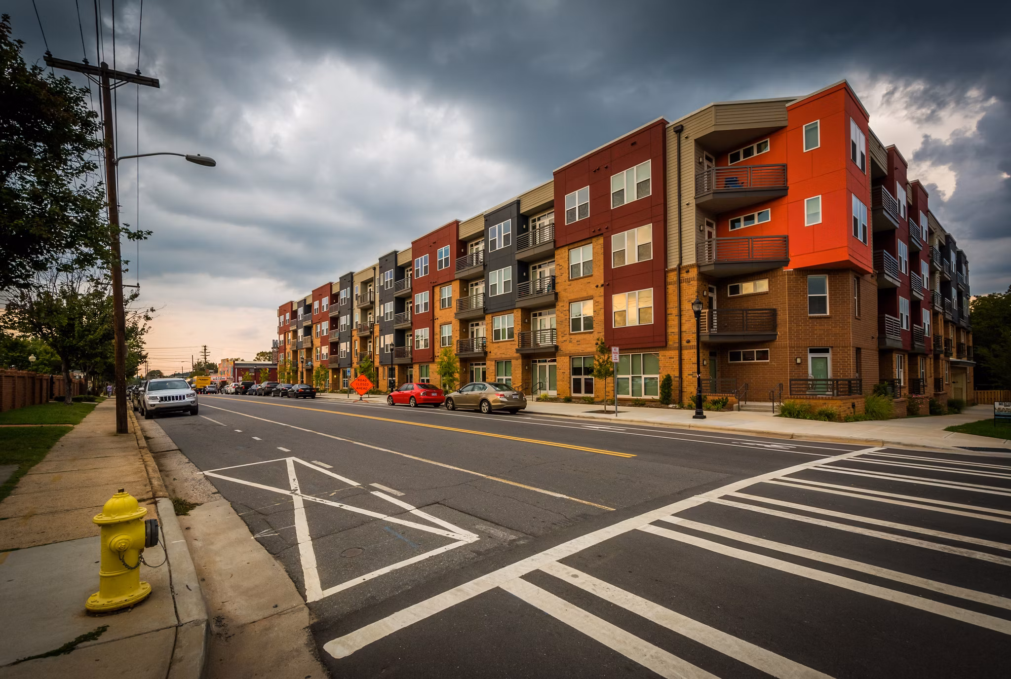 Intersection and commercial buildings in the vibrant NoDa arts district of Charlotte, North Carolina.