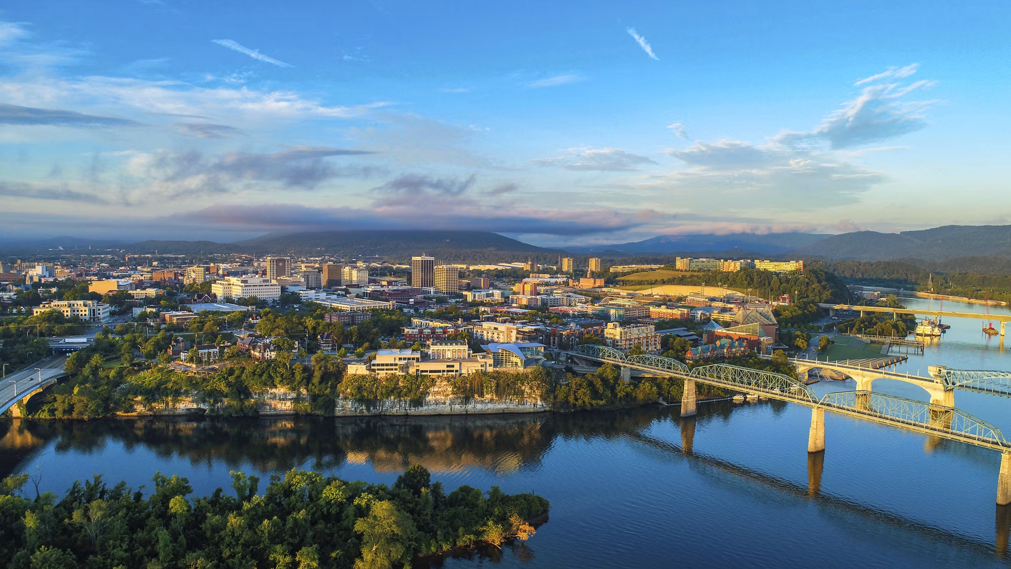 Drone Aerial of Downtown Chattanooga TN Skyline, Coolidge Park and Market Street Bridge.