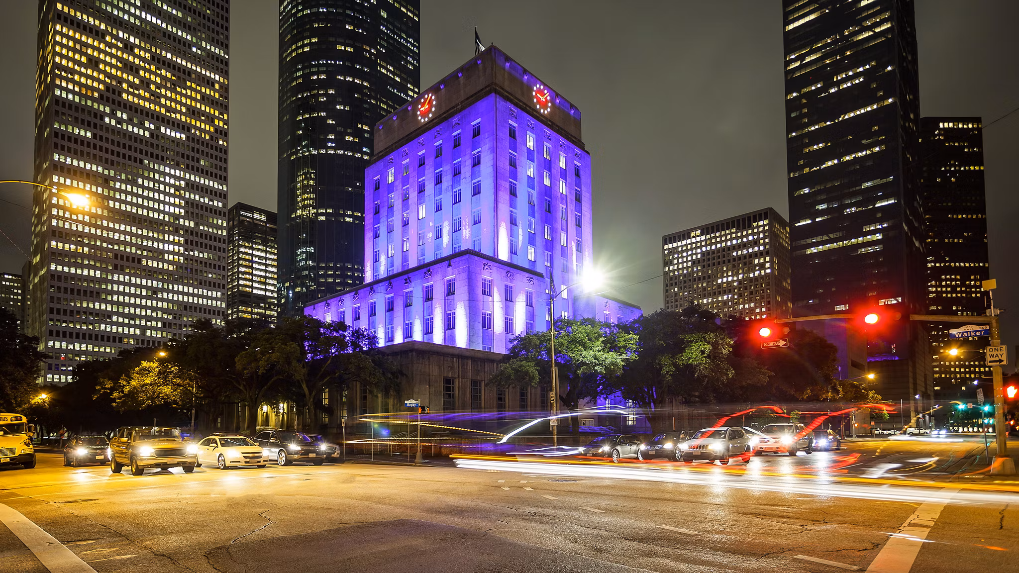 Houston City Hall building and traffic at night in downtown Houston, Texas
