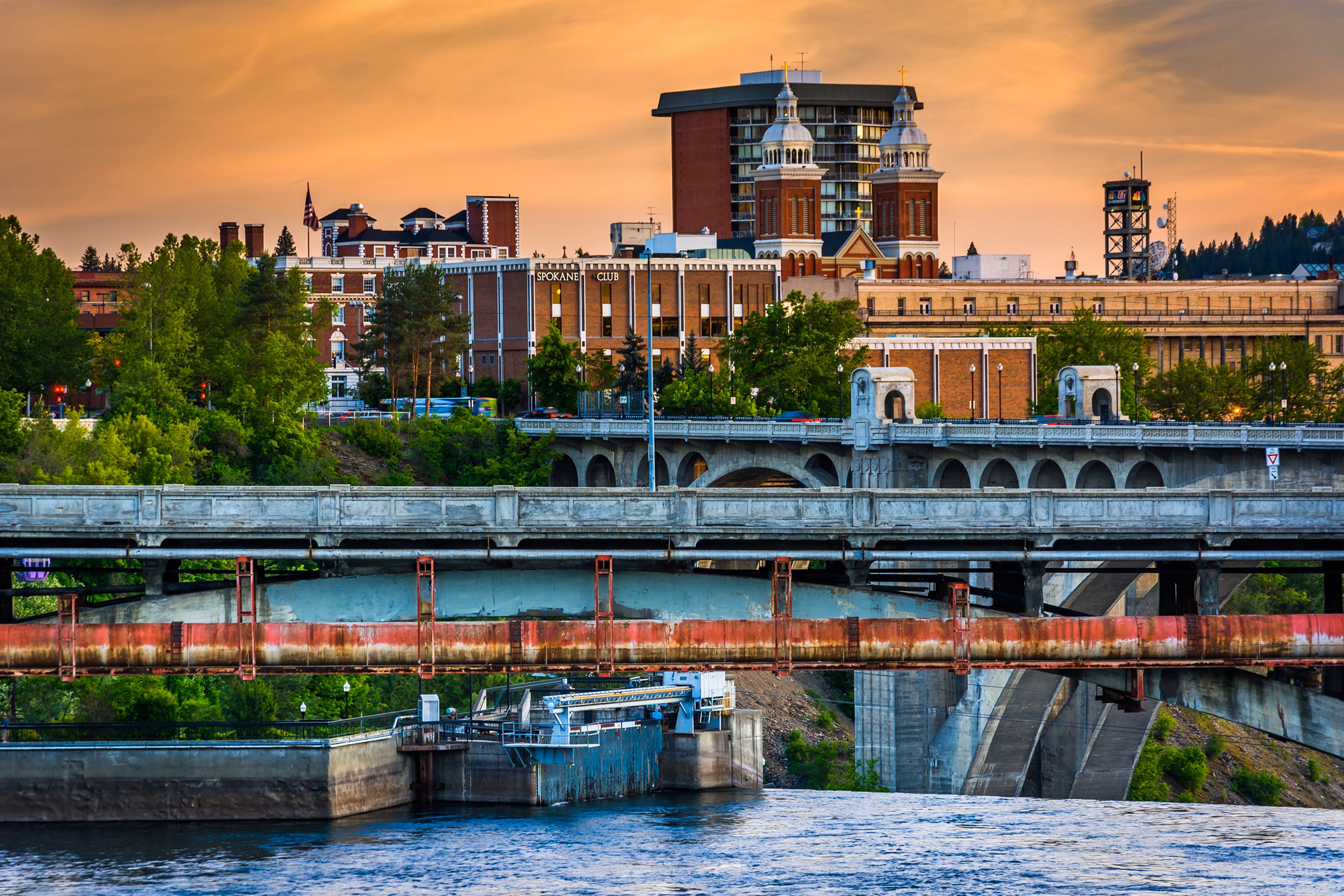 Bridges over the Spokane River and buildings at sunset, in Spokane, Washington.