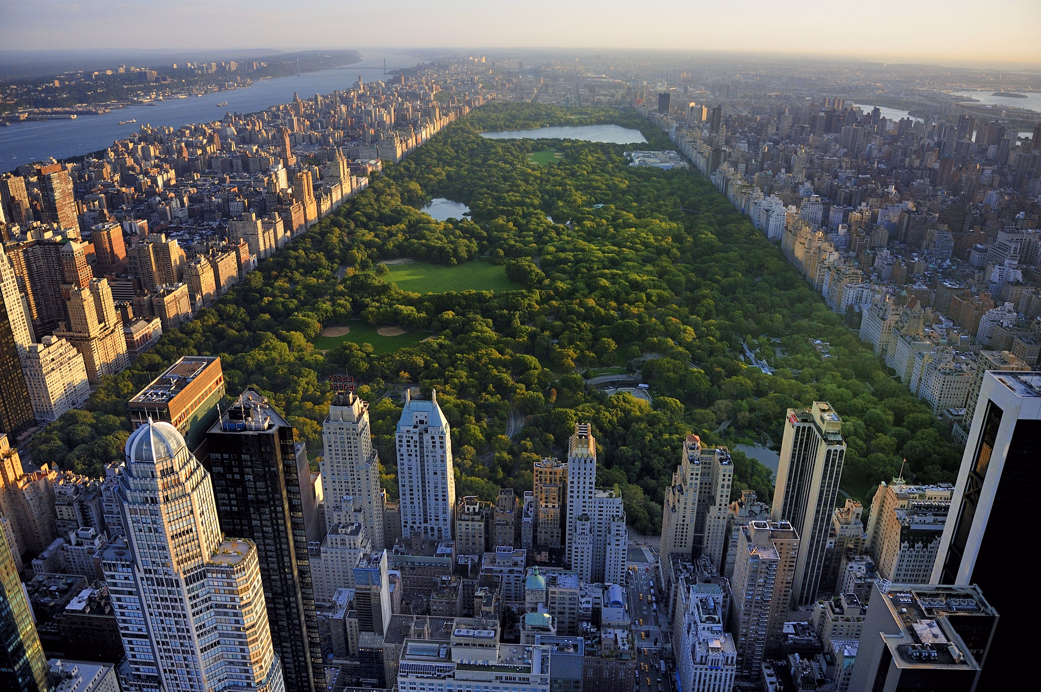 Central Park aerial view, Manhattan, New York; Park is surrounded by skyscraper 