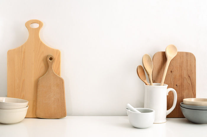 Wooden kitchen utensils in a white kitchen | Blog | Greystar
