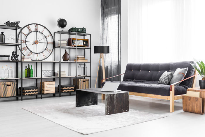 Living room space with a black couch and bamboo accents| Blog | Greystar