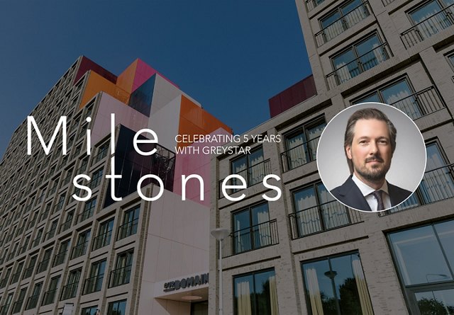 Photo of a modern, colorful building with the text 'Milestones' overlaid, featuring a headshot of a man to the right who is being highlighted in the piece.