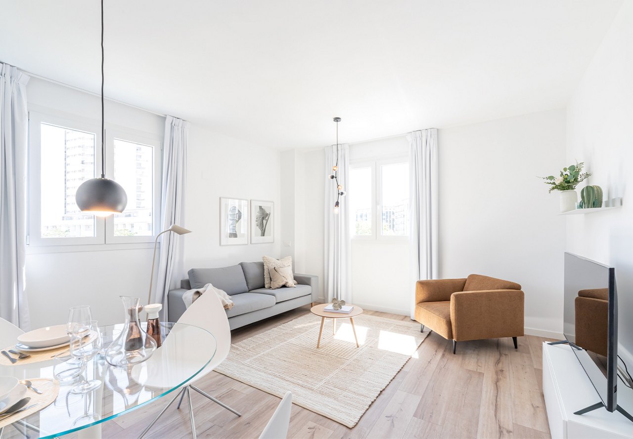 Clean living area with light colors and modern finishes