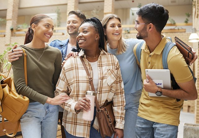 A diverse group of students walking through a student housing community, carrying their supplies for class, creating a lively and energetic atmosphere.