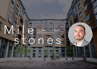 Banner featuring a modern apartment complex with the words 'Milestones, Celebrating 5 Years with Greystar' and a profile inset of a smiling man.