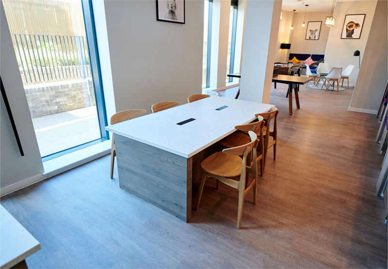 interior photo of study room with desk and chairs