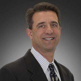 portrait of smiling man in suit