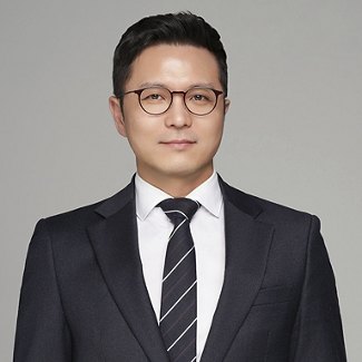Greystar employee in black suit and tie