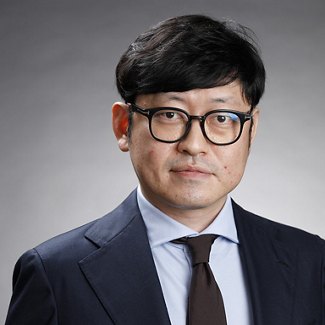 Greystar employee in black suit and black tie