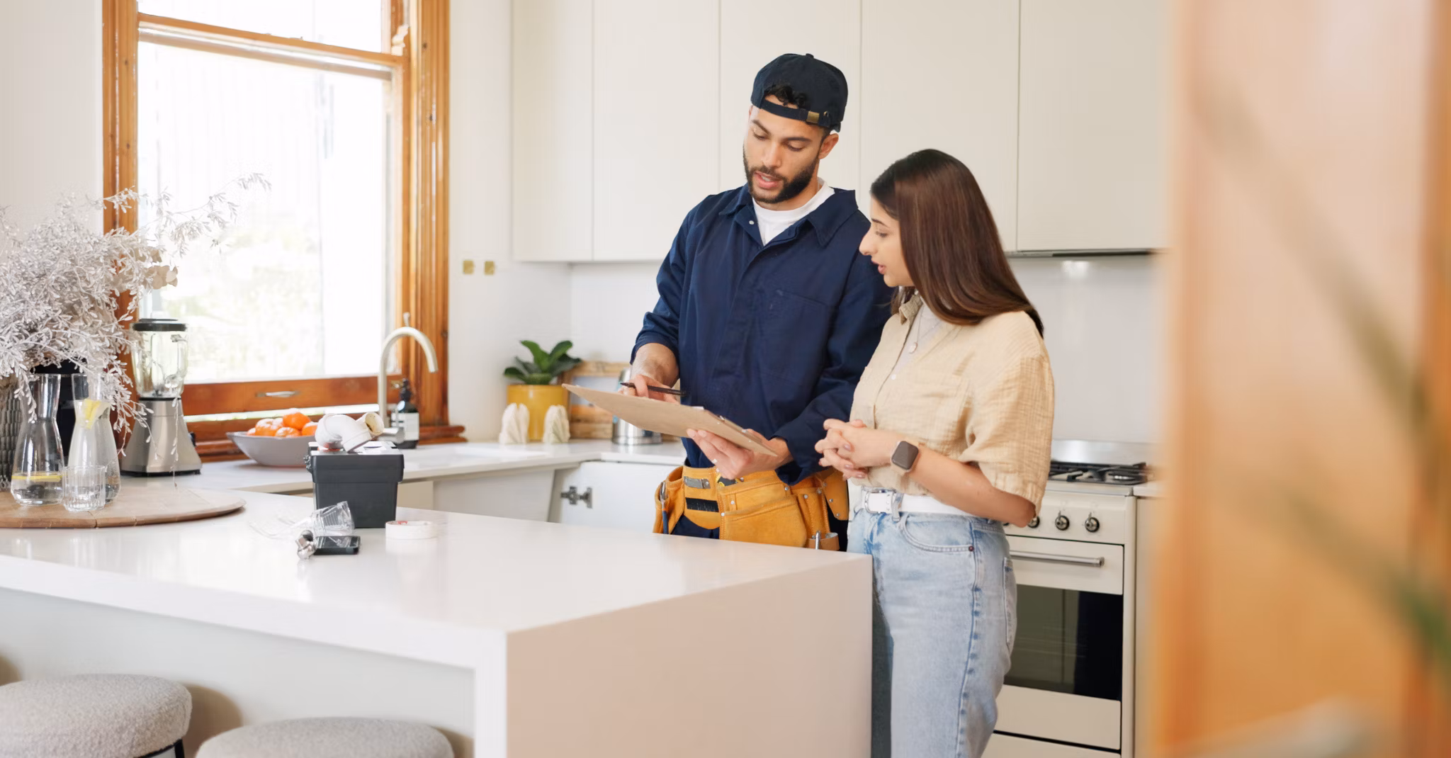 Woman, kitchen and plumber with contract on clipboard for maintenance service, information and repairs. House, discussion and man with notes in checklist for renovation, inspection or client feedback.