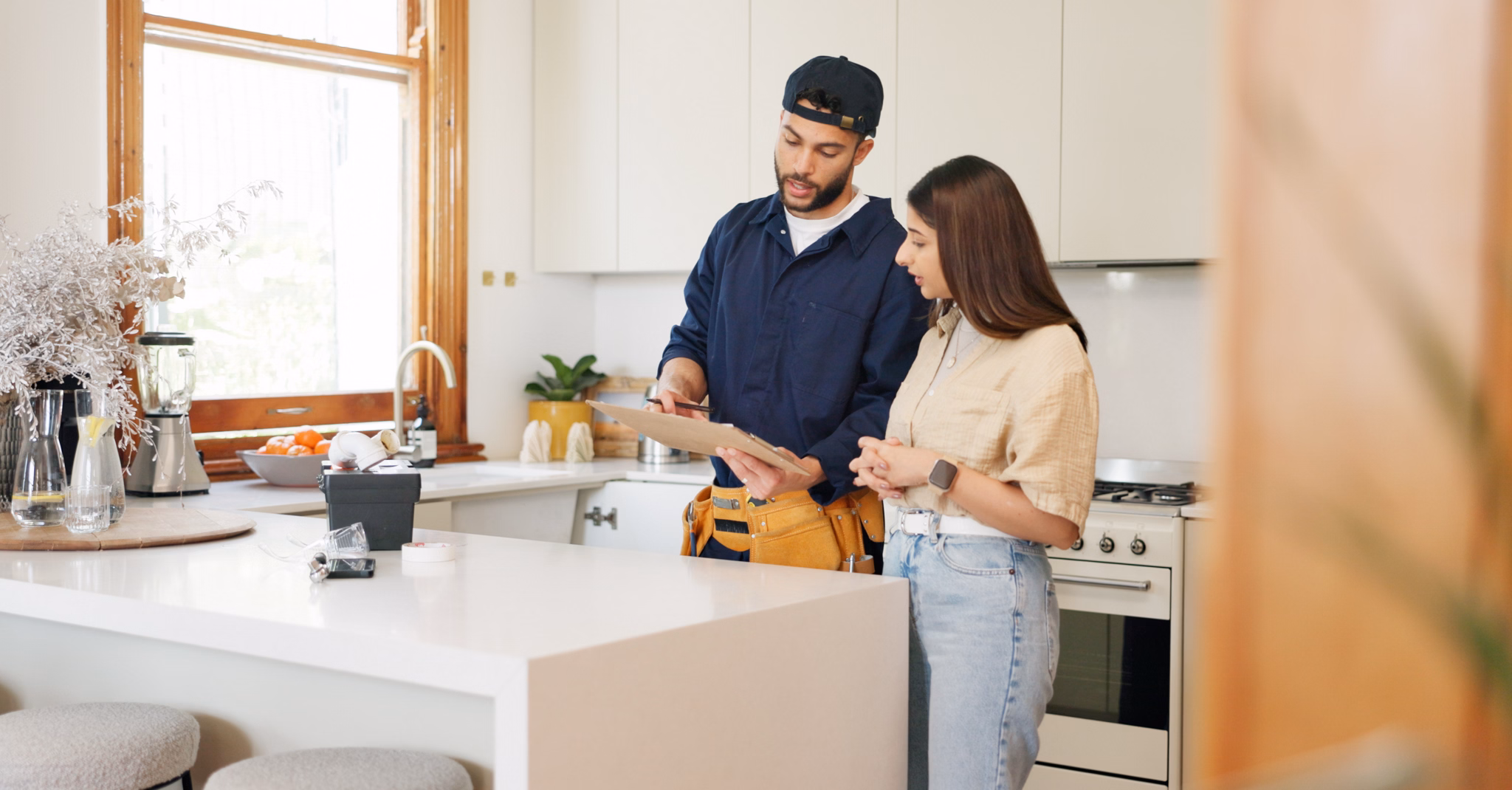 Woman, kitchen and plumber with contract on clipboard for maintenance service, information and repairs. House, discussion and man with notes in checklist for renovation, inspection or client feedback.